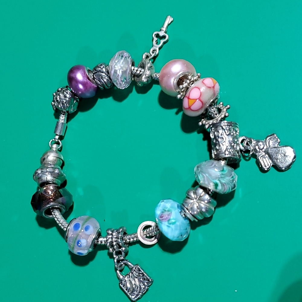 Silver magnetic closure  with charms bracelet.